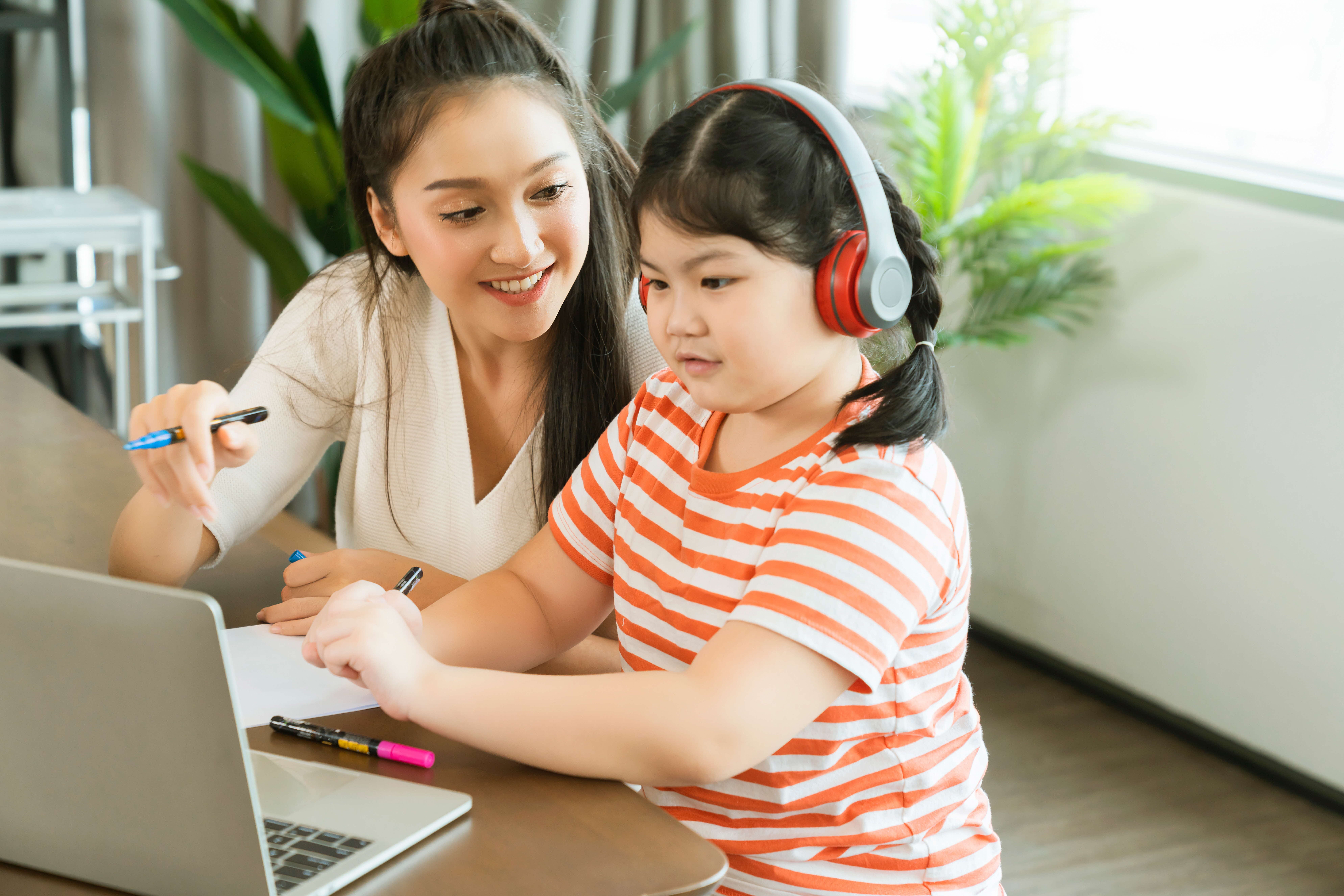 Mother with child on laptop